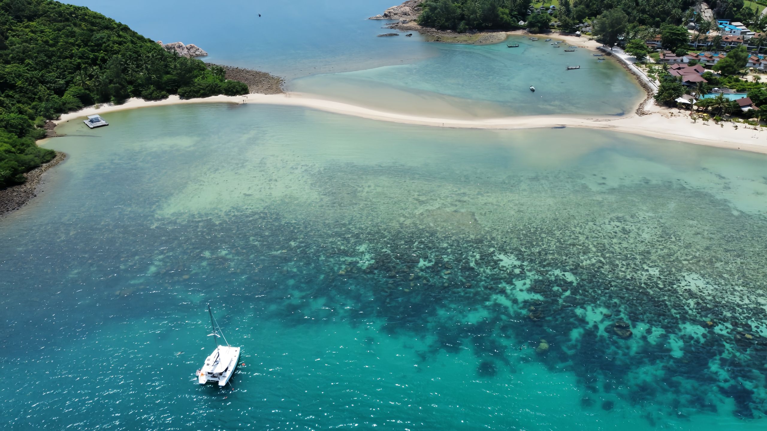 Aerial view of a catamaran anchored off a Koh Samui sandbank